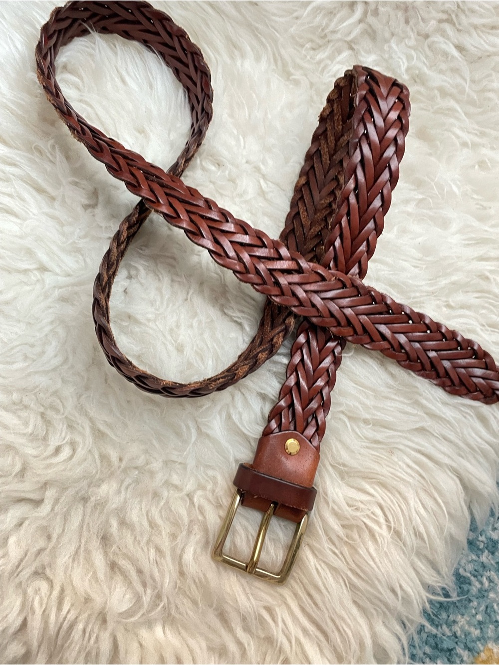 Brown braided leather belt with gold tone buckle. Made in Italy 52” length